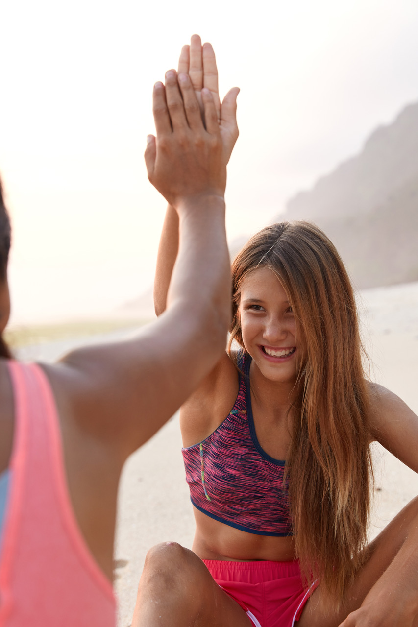 women-give-each-other-high-five